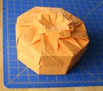 A large octagonal box made from recycled American Letter paper.  I don't recall whether this was a variation of a Fuse design or whether it has rather more "me" in it.  Since Fuse has designed so many boxes of this type, it is hard to know whether one's invention is just another wheel.