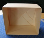 The Sox Box.  April 2007.  Designed and folded by R. Lyndall Wemm. 
This one is made from rather boring buff colored card stock.  Single pieces of very large decorative card stock is hard to find, and postage is steep.