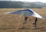 July 2006.    This proves that Rosemary managed to get off the ground on the hang glider. Subsequent spinal problems and surgeries prevented her from continuing with this sport.  Peter flew enough for two over the next few months. He now has his Hang 3 rating.
