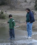 Tristan walking, gingerly, on water.