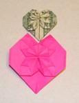 Feb 2007.

A "guessed" version of a dollar bill heart by "Butch Studly" - and a variant using half a sheet of American Letter paper divided on the long axis.  Studly's books (Romantic Folds) are available on eBay or Amazon Books for a small cost.