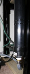 Bottom (inlet) of the carbon filter.  Note that the water flows UP so that gravity will keep the carbon together.  I was worried about it settling and a gap/tunnel making its way along the top of the pipe if it was laying on its side, allowing the chlorine/chloramine to bypass it.

The end cap is a female inspection adapter, with a male 2-inch screw-in plug.  I drilled a hole in the plug and tapped it with a 3/4 inch pipe thread tap.  Then I screwed in a 3/4 -> 1/2 inch reducing adapter with a mixture of solvent on its thread to make sure that it bonded well and there were no leaks.  Turns out this was the most water-tight part of the entire project....