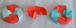 OCTAGONAL BOX LID: D01a and D01b 

FROM:  4 square sheets in diamond orientation

VIEW:  Outside view of two versions of completed lids.  One         is put together from the right, the other from the left.                            Completed unit from same perspective.