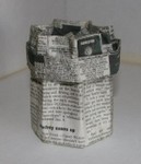 The newspaper box after one application of home made papier mache paste followed by a minor reshape after the glue dried.